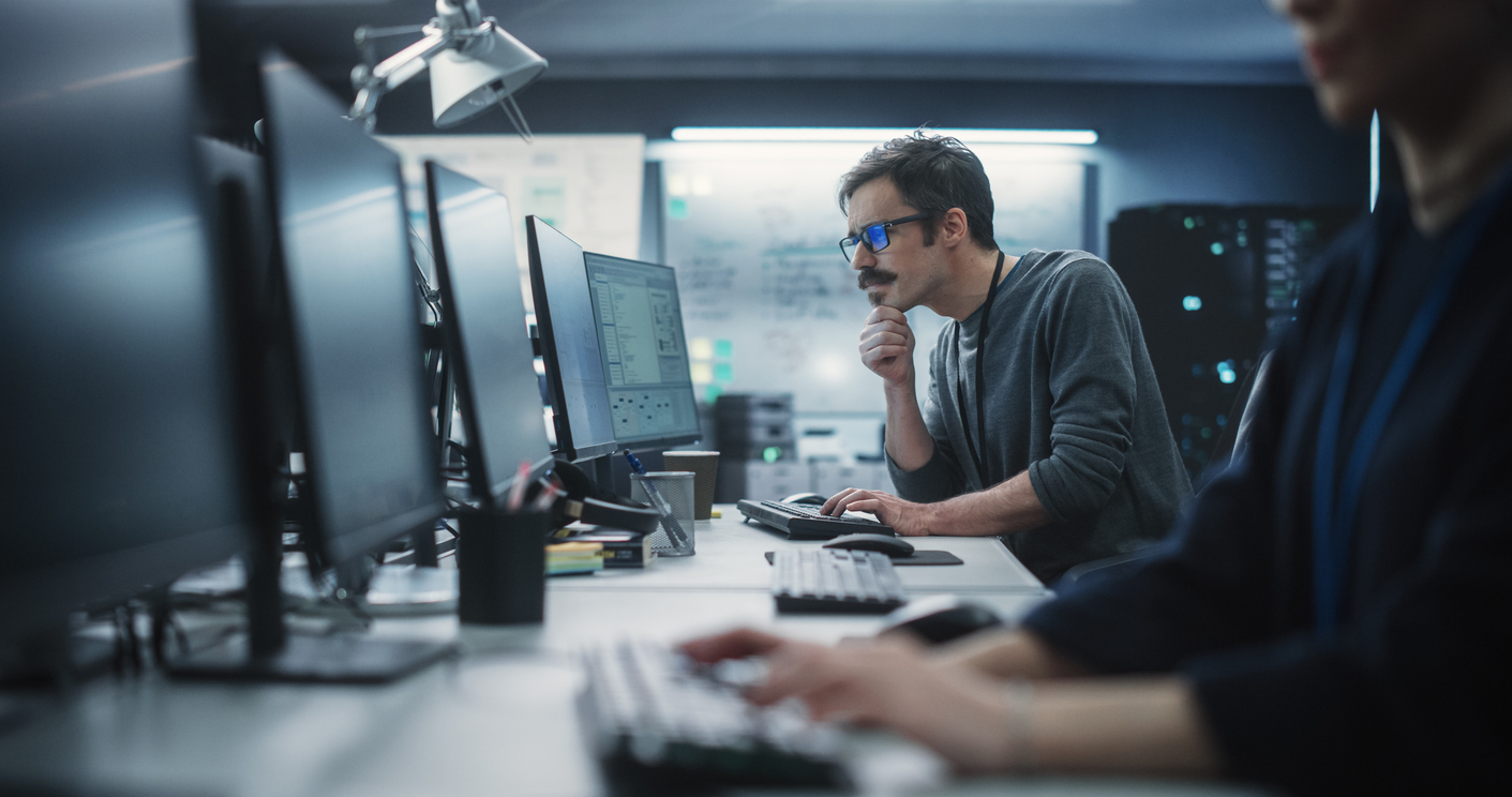 Cybersecurity Professionals Work in Their Office..jpg